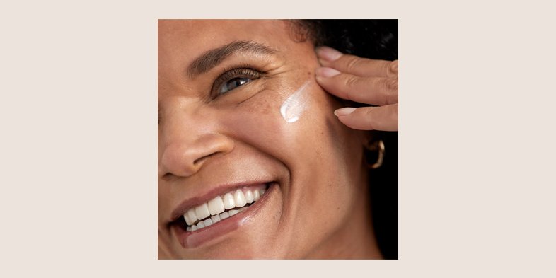A lady applying SPF